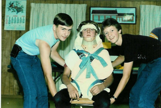 I don't think he's going anywhere... Tim and Mike practice patient extrication in the Advanced First Aid class at the station in 1986.